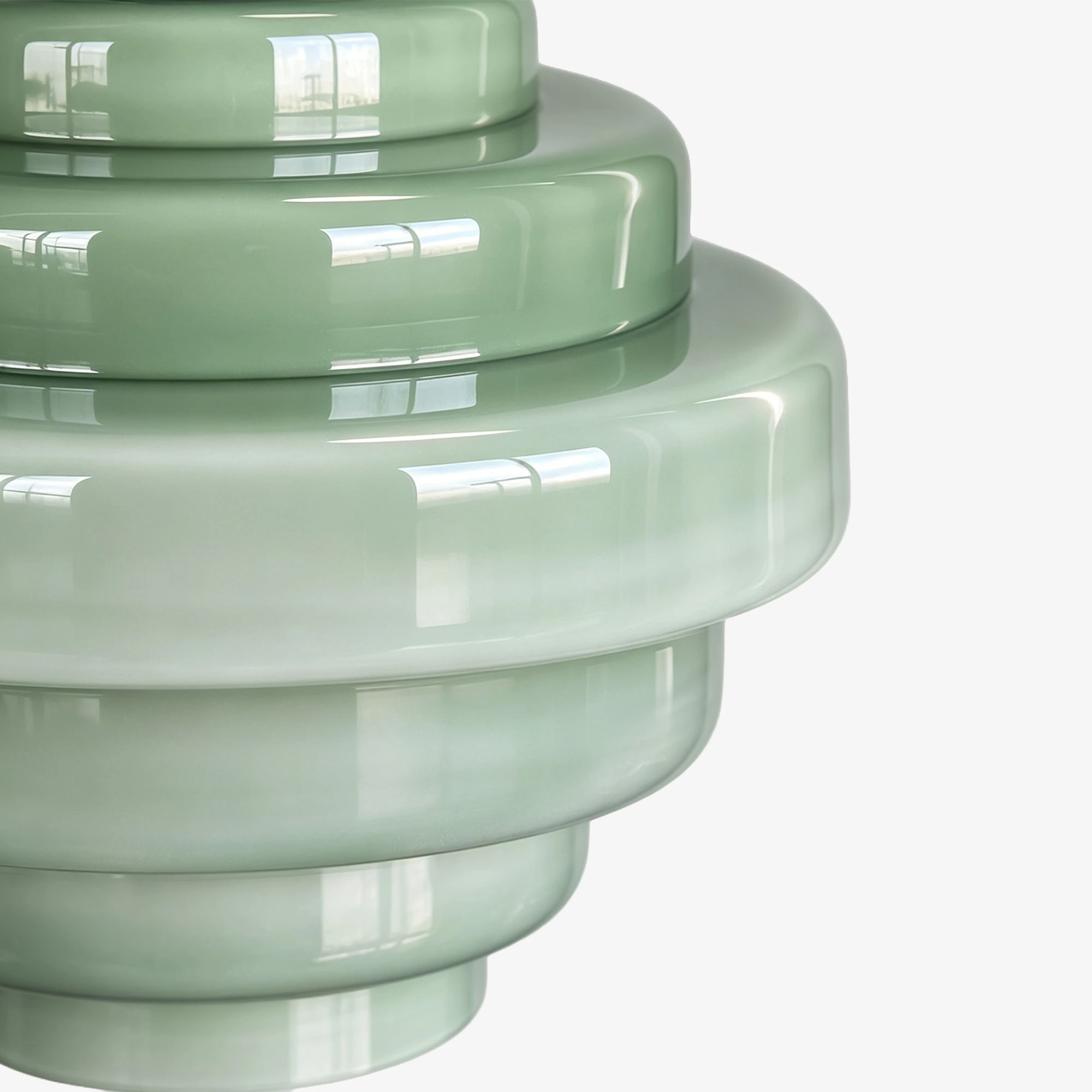Närbild av glansig grön gradient glasskärm med pendel