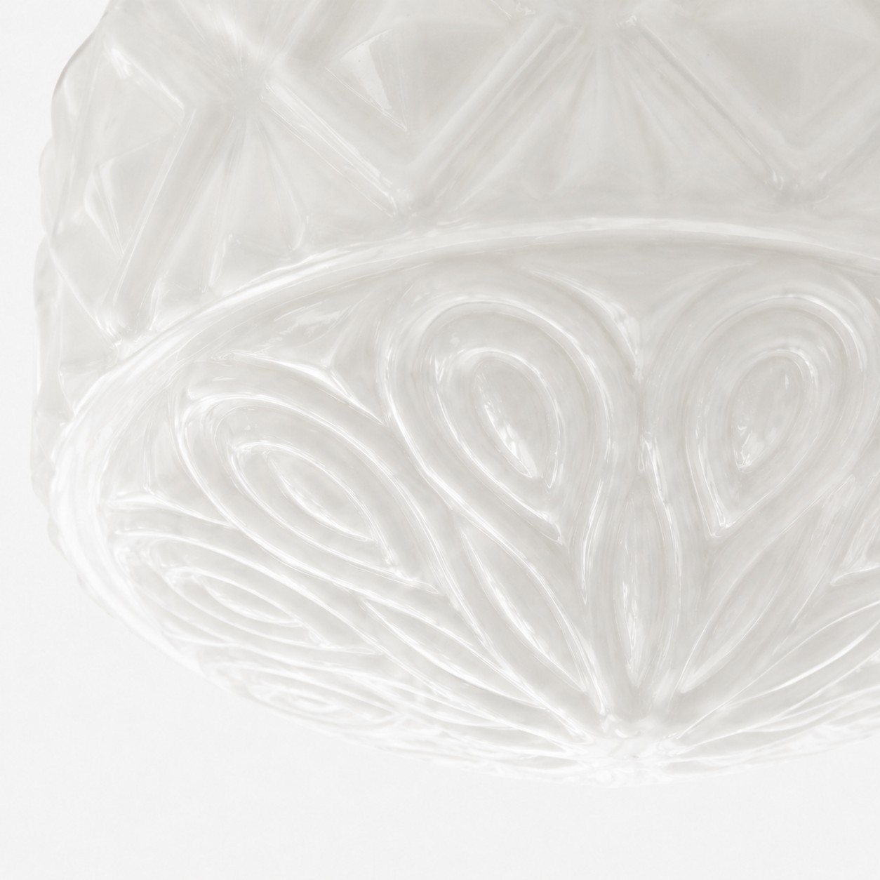 Milky glass floral relief detail on ceiling light