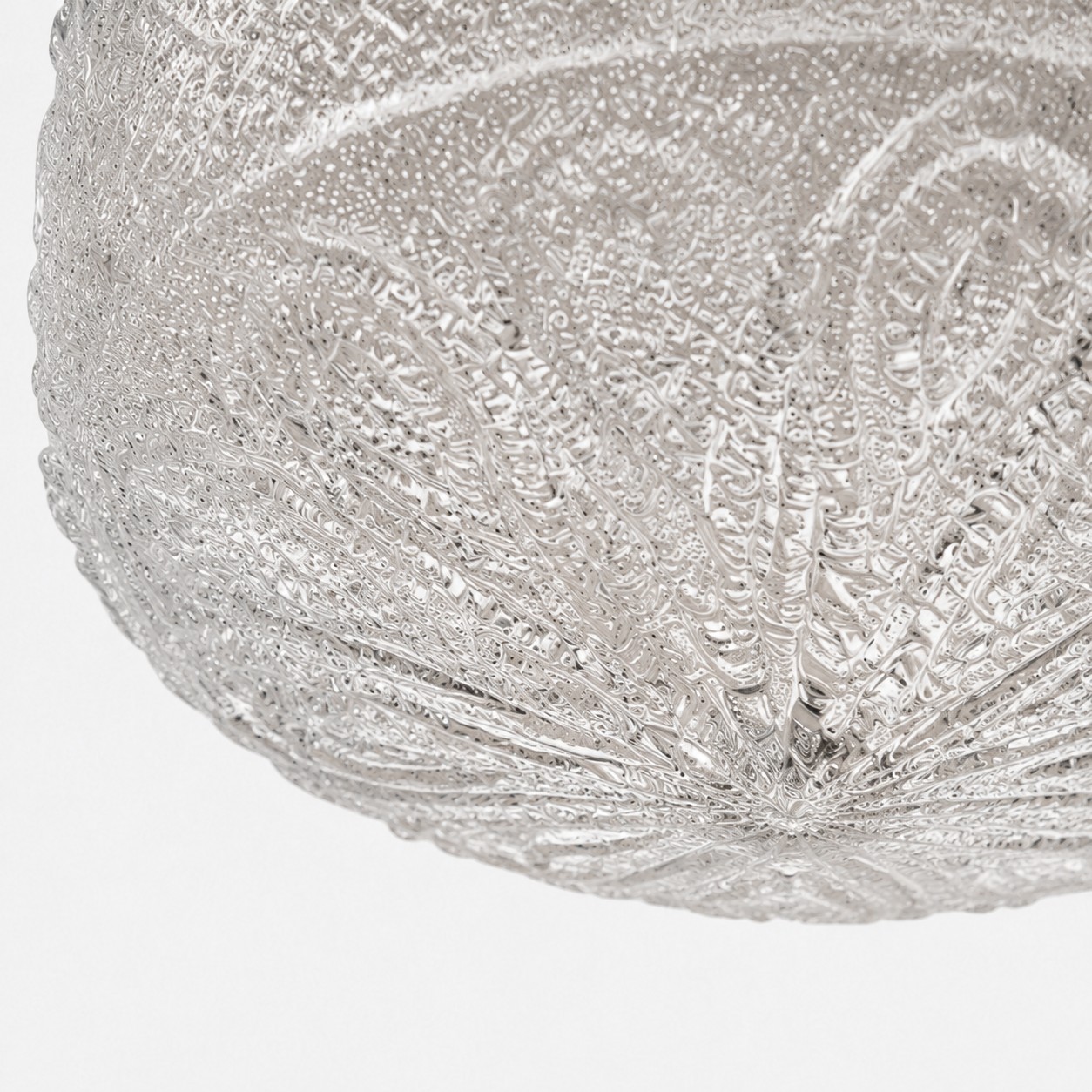 Textured glass relief close-up on flush mount ceiling light