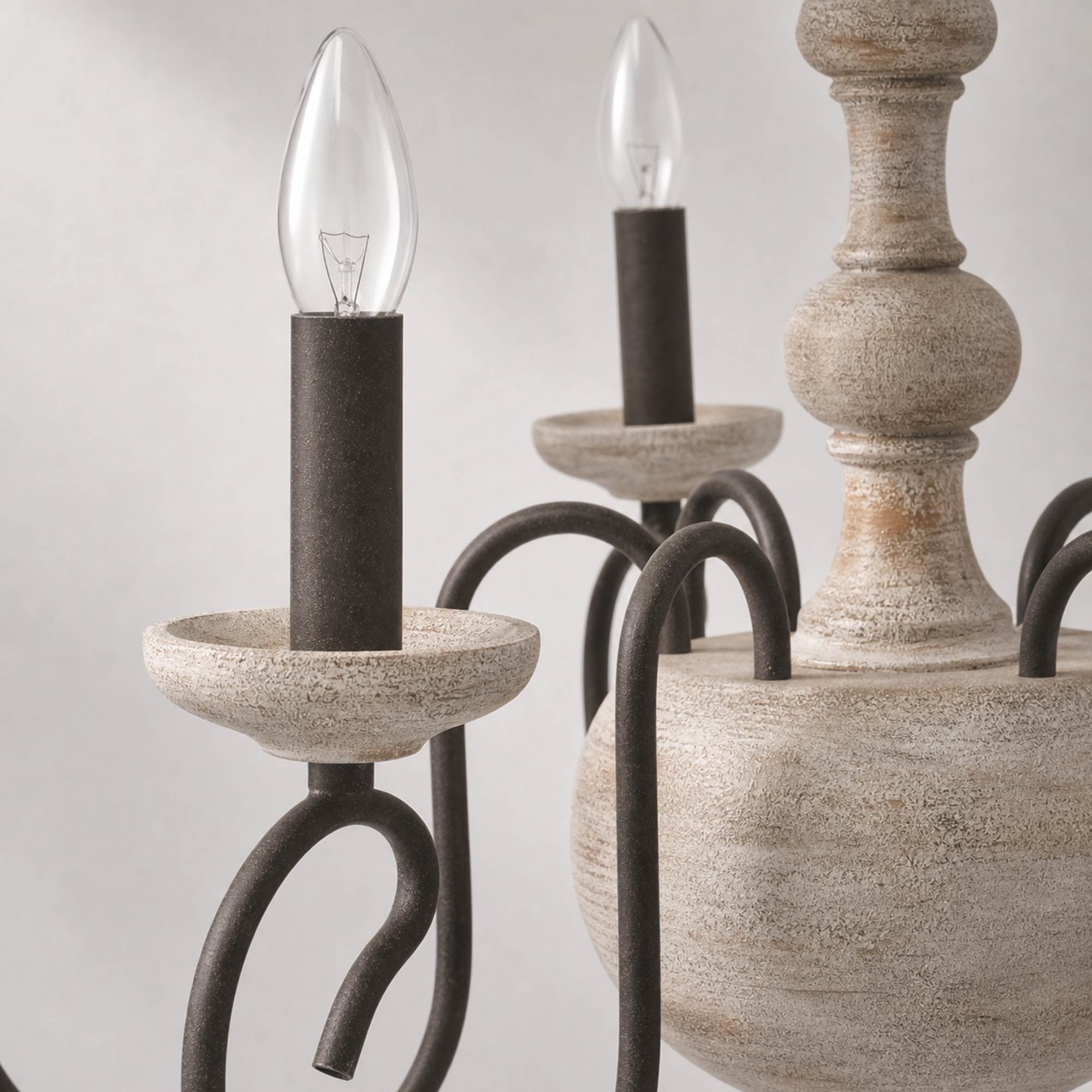 close detail of candle socket and scroll arm