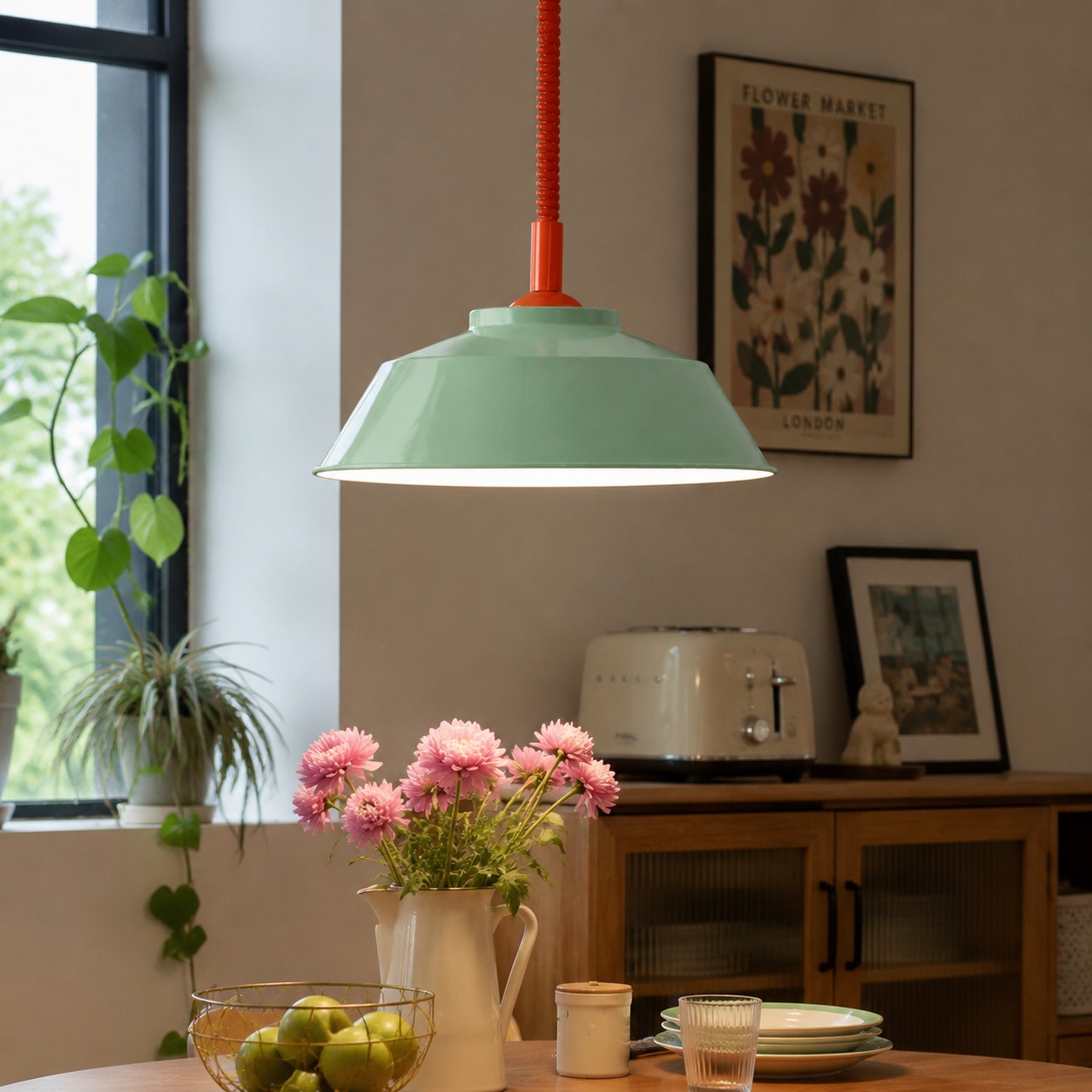 Memphis pull-down pendant in a dining space