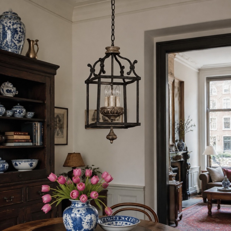 Rustic birdcage pendant lamp installed above a dining room table