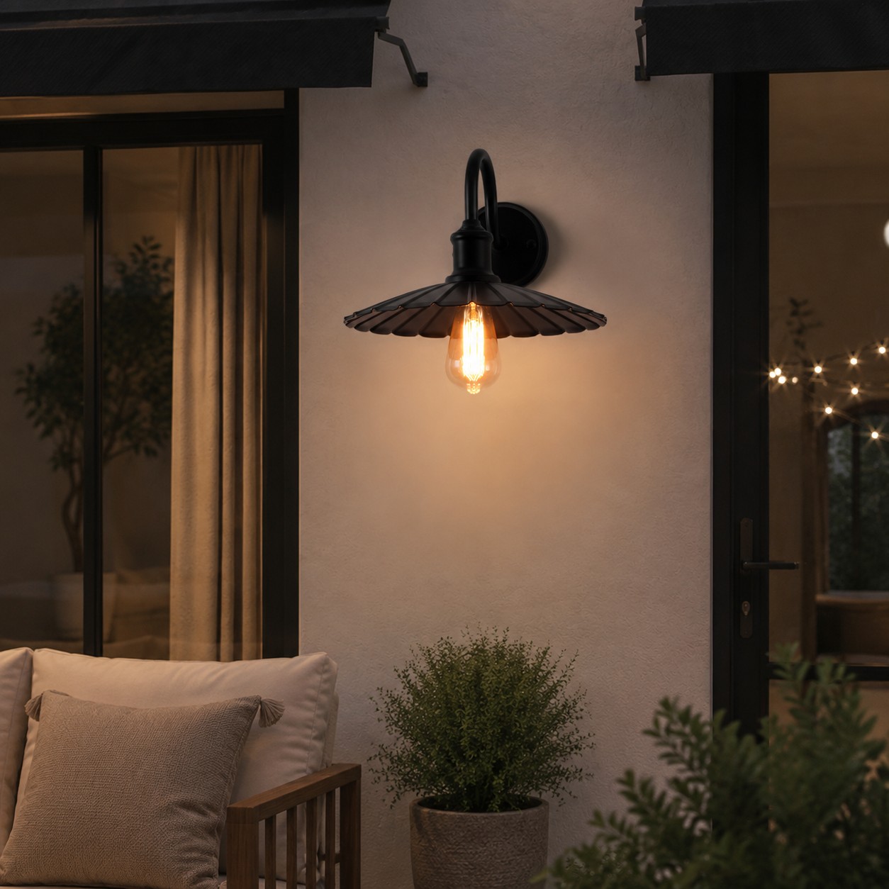 Outdoor wall sconce beside a patio seating area