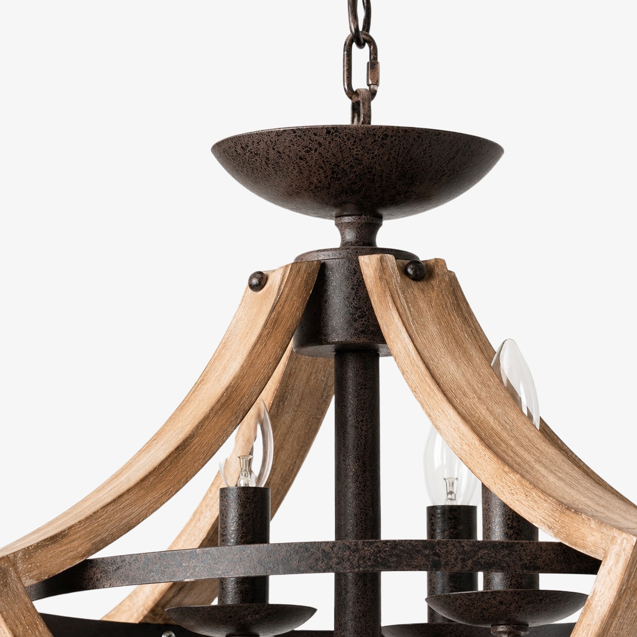 Distressed wood and rust-finished metal chandelier detail