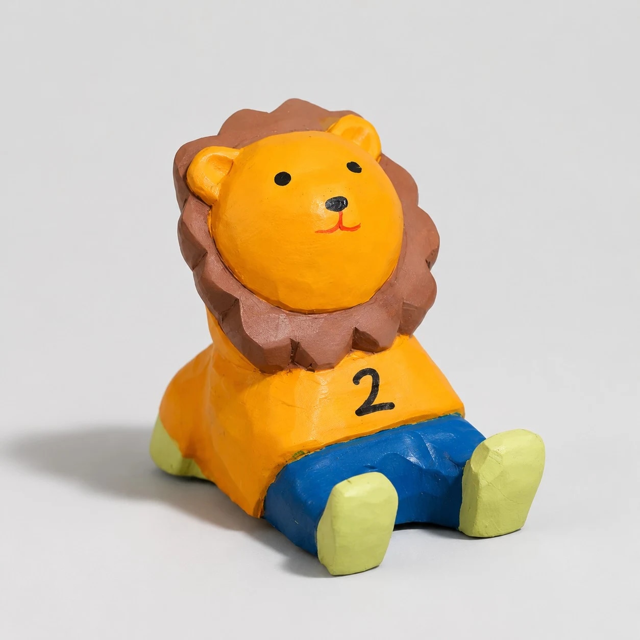 Hand-carved wooden animal phone stand