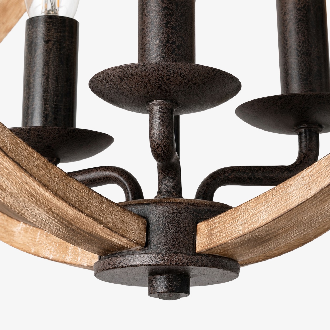 Distressed wood and rust-finished metal chandelier detail