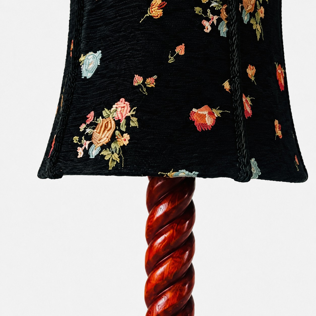 floral fabric and carved wood table lamp