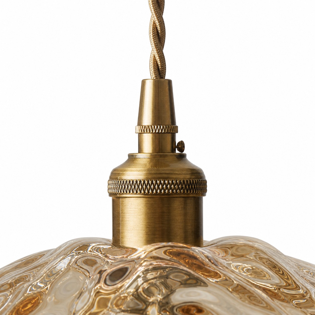 Close-up of antique brass socket and twisted cord